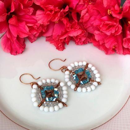 Copper earrings wrapped with white ..